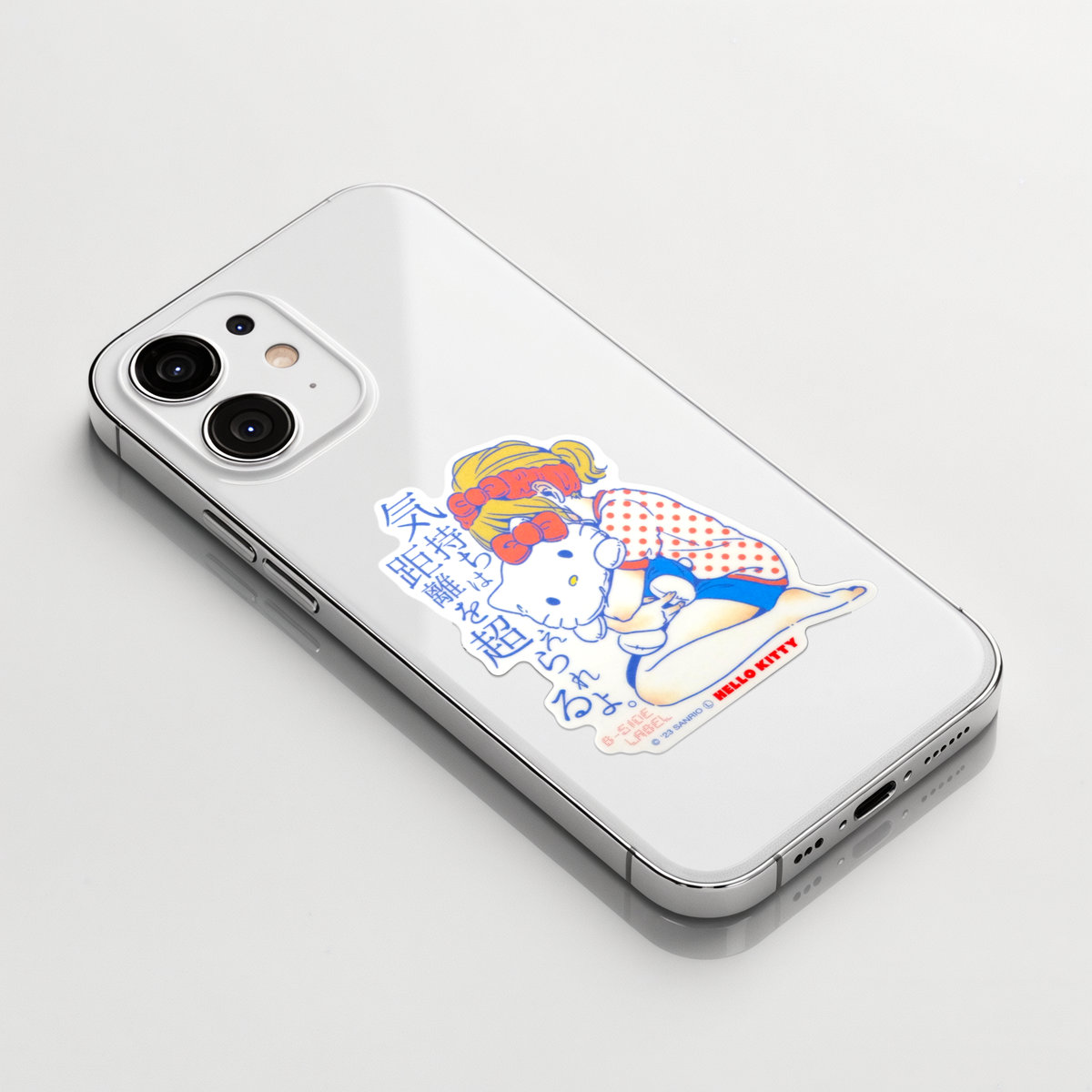 Sanrio Hello Kitty Cute Girl Hug Toy   ✦ B-Side Label Sticker on a white iPhone
