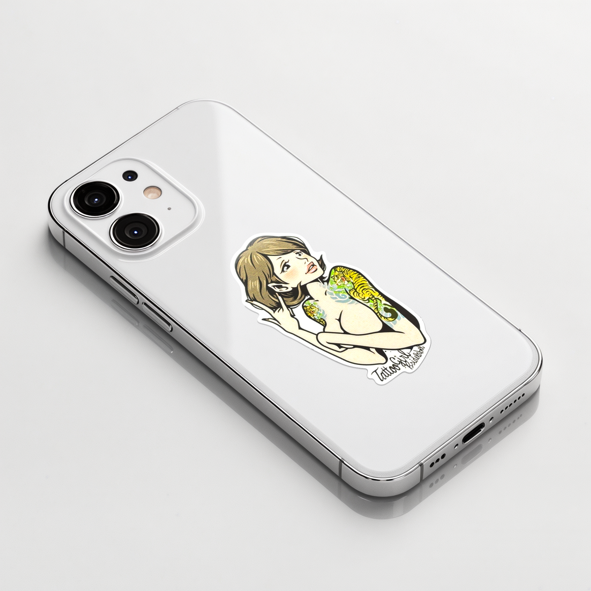 Topless Tattooed Woman ✦ B-Side Label Sticker on a white iPhone