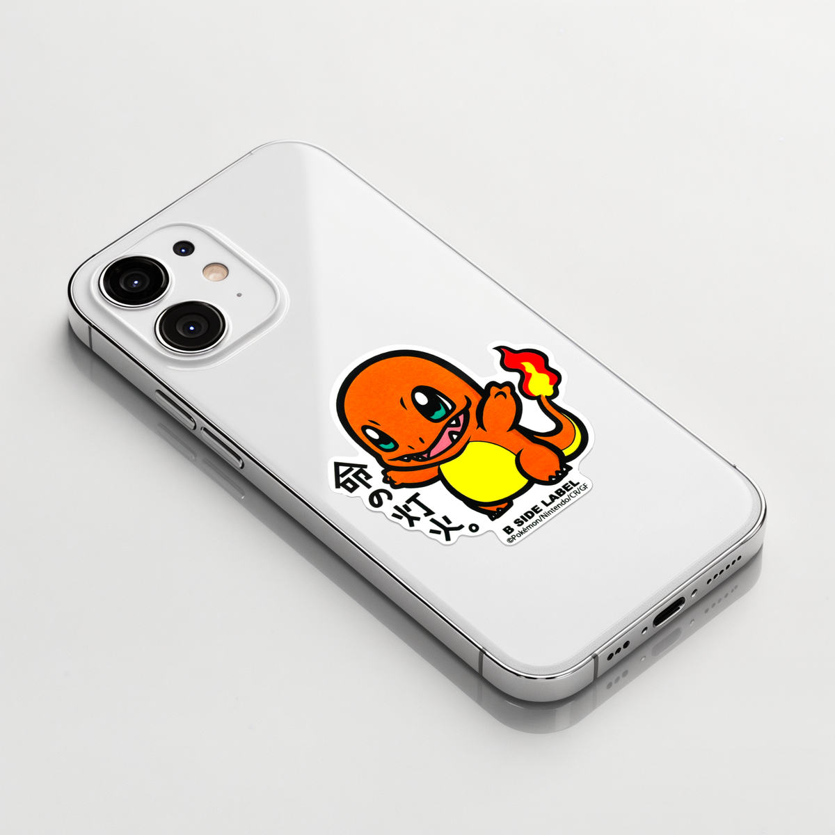 Pokémon Charmander ✦ B-Side Label Sticker on a white iPhone