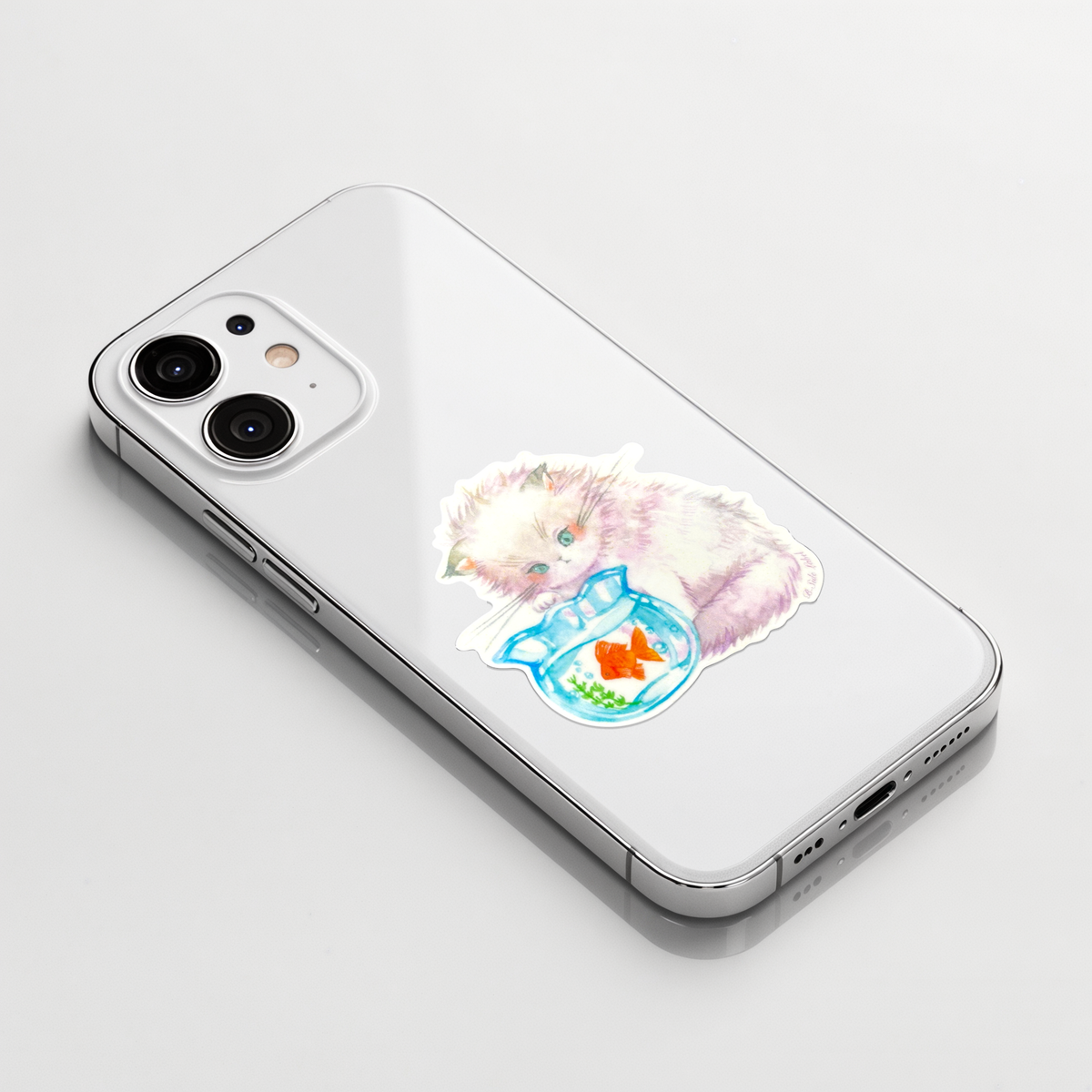 Cute Cat and Goldfish ✦ B-Side Label Sticker on a white iPhone