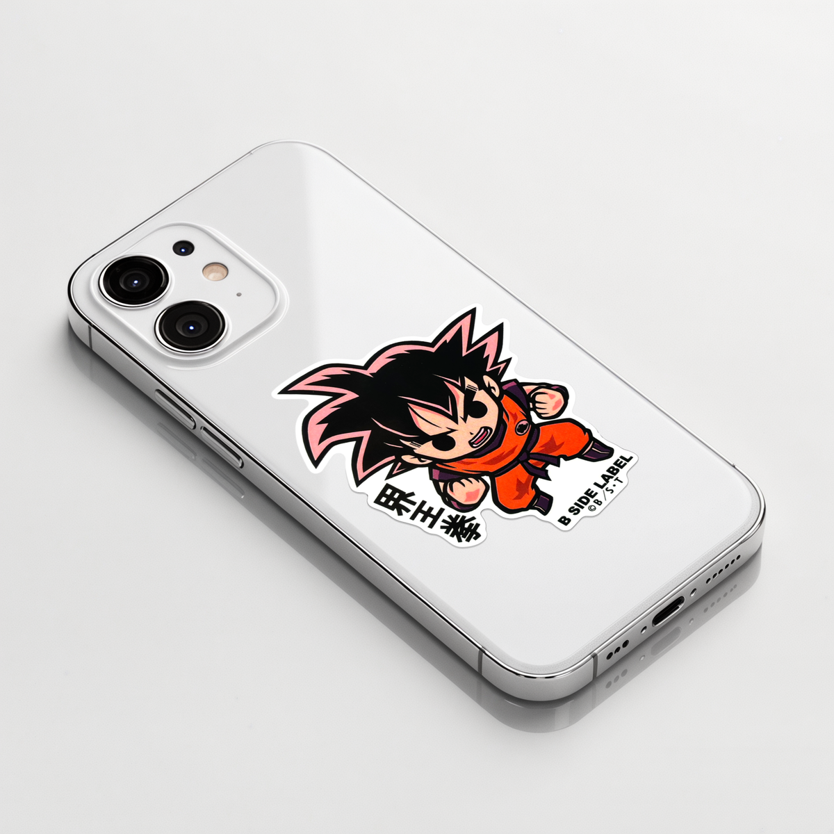 Dragon Ball Z - Goku Kaioken ✦ B-Side Label Sticker on a white iPhone