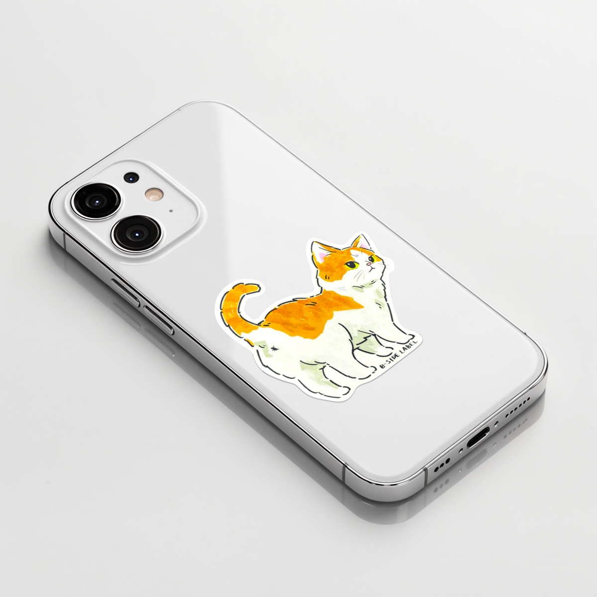 Cute Brown White Kitten Butt ✦ B-Side Label Sticker on a white iPhone