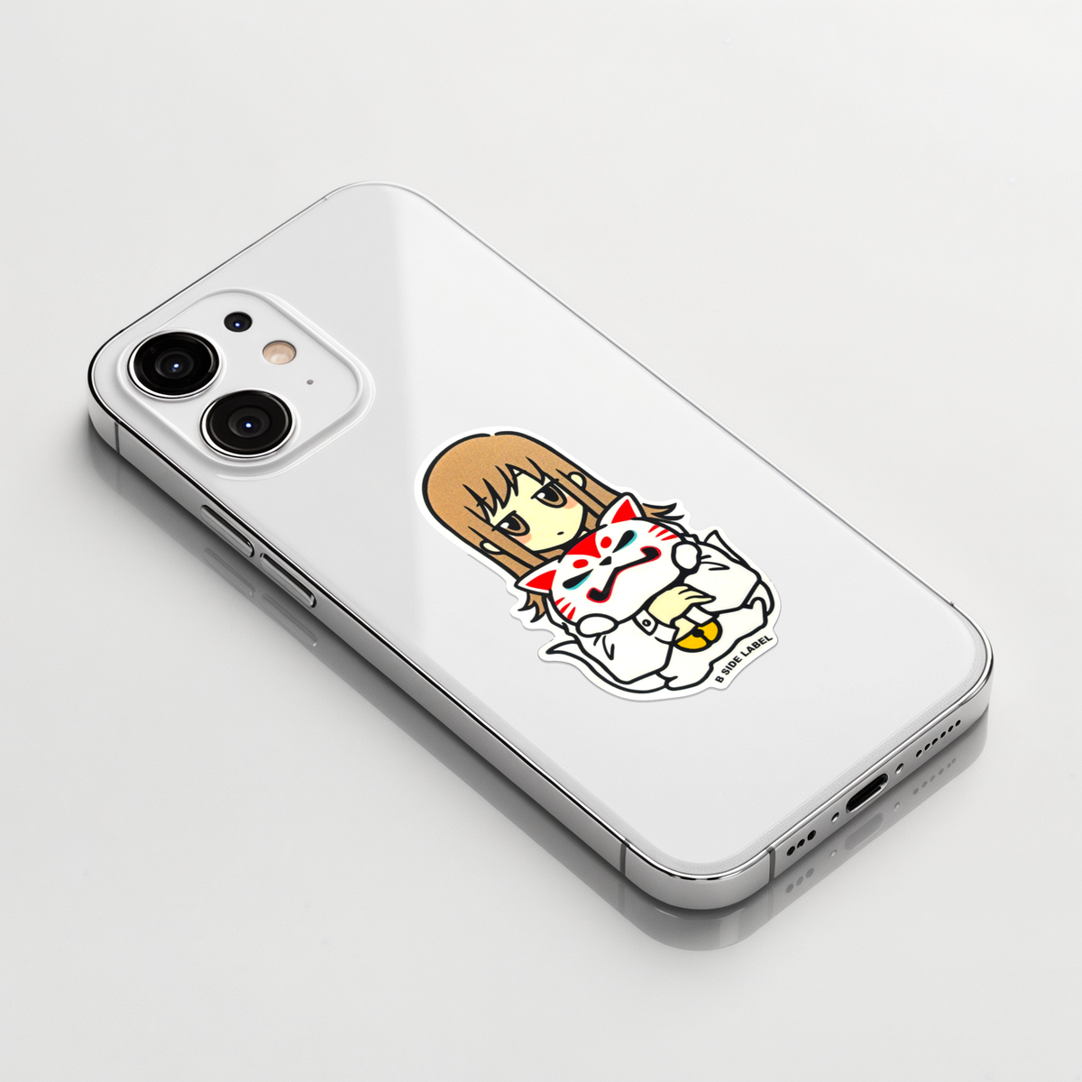 Cute Girl Holding Oinari ✦ B-Side Label Sticker on a white iPhone