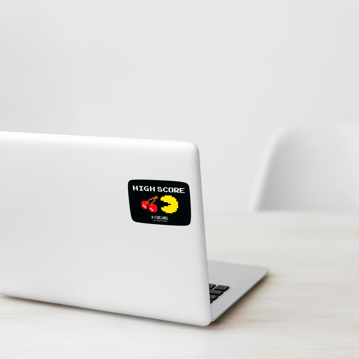 Pac Man High Score ✦ B-Side Label Sticker shown on a white laptop; illustrative placement, not to scale.
