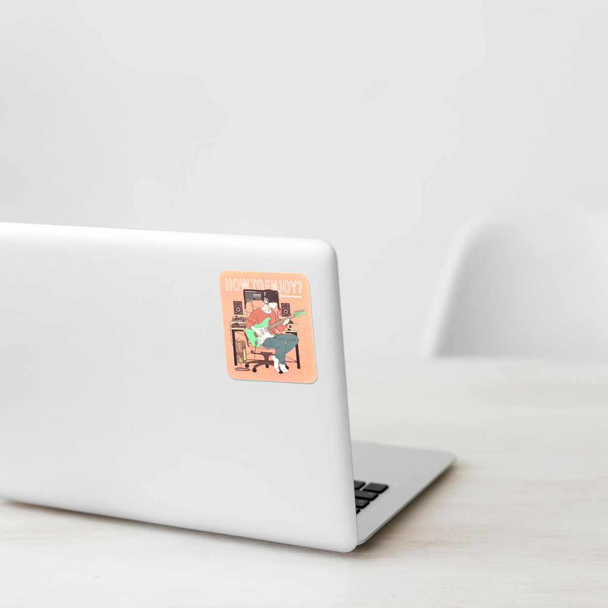 Man Playing Guitar sticker shown on a white laptop; illustrative placement, not to scale.