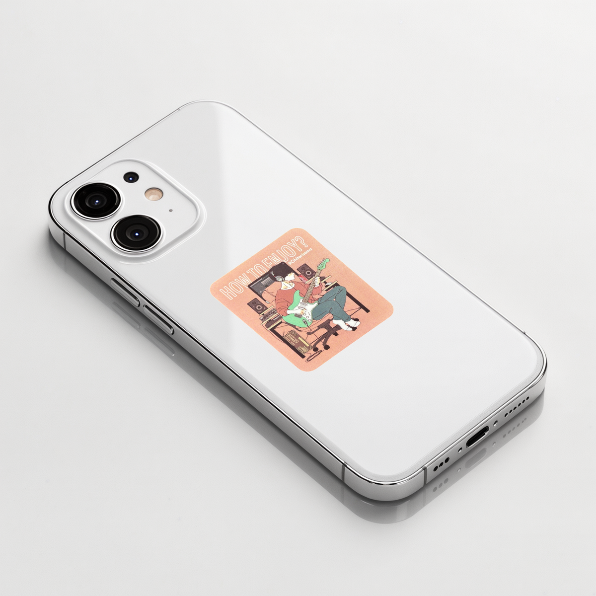 Man Playing Guitar sticker shown on a white iPhone; illustrative placement, not to scale.