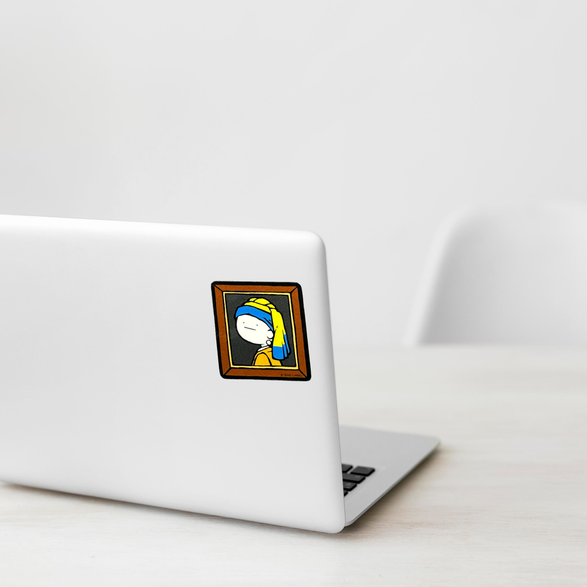 Girl Pearl Earring Portrait sticker shown on a white laptop; illustrative placement, not to scale.