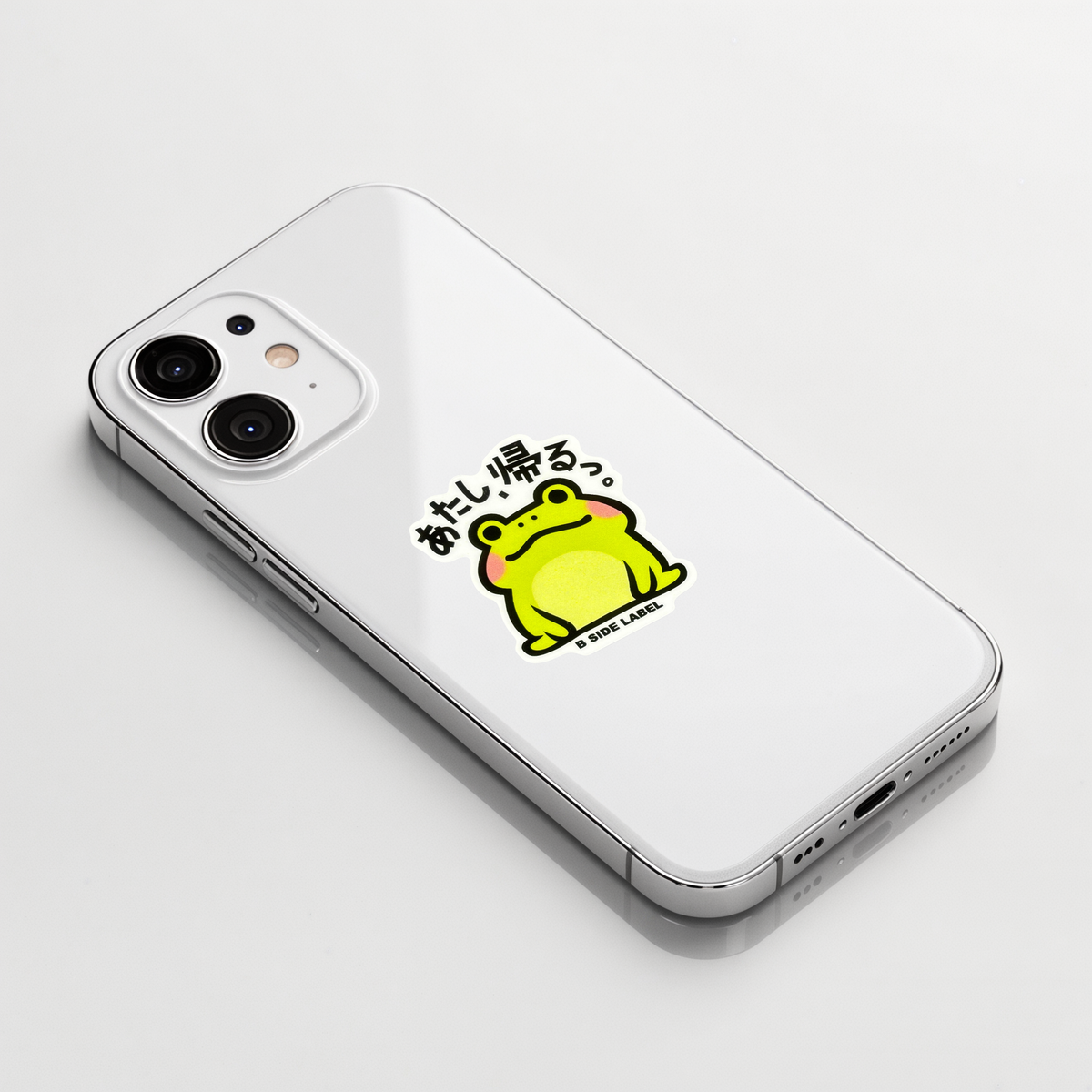 Cute Baby Frog ✦ B-Side Label Sticker shown on a white iPhone; illustrative placement, not to scale.