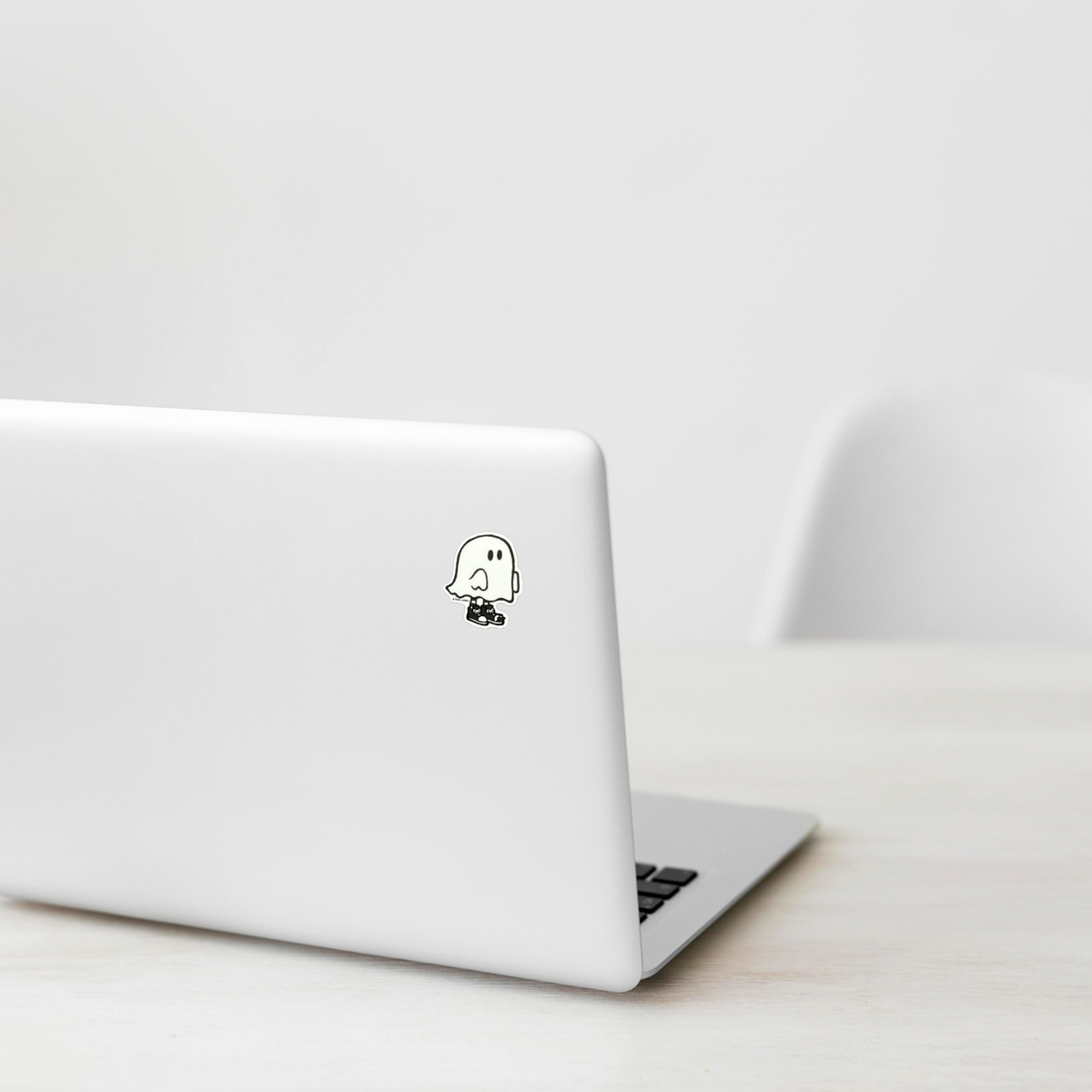Cute Baby Ghost sticker on laptop — Shopify Small PhotoRoom template, verified original Ghost photograph