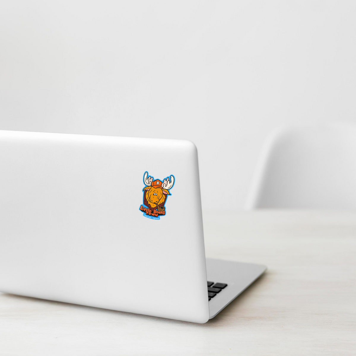 Moose Baseball Cap ✦ B-Side Label Sticker on white laptop — Shopify Medium PhotoRoom template, orientation corrected from verified original photograph