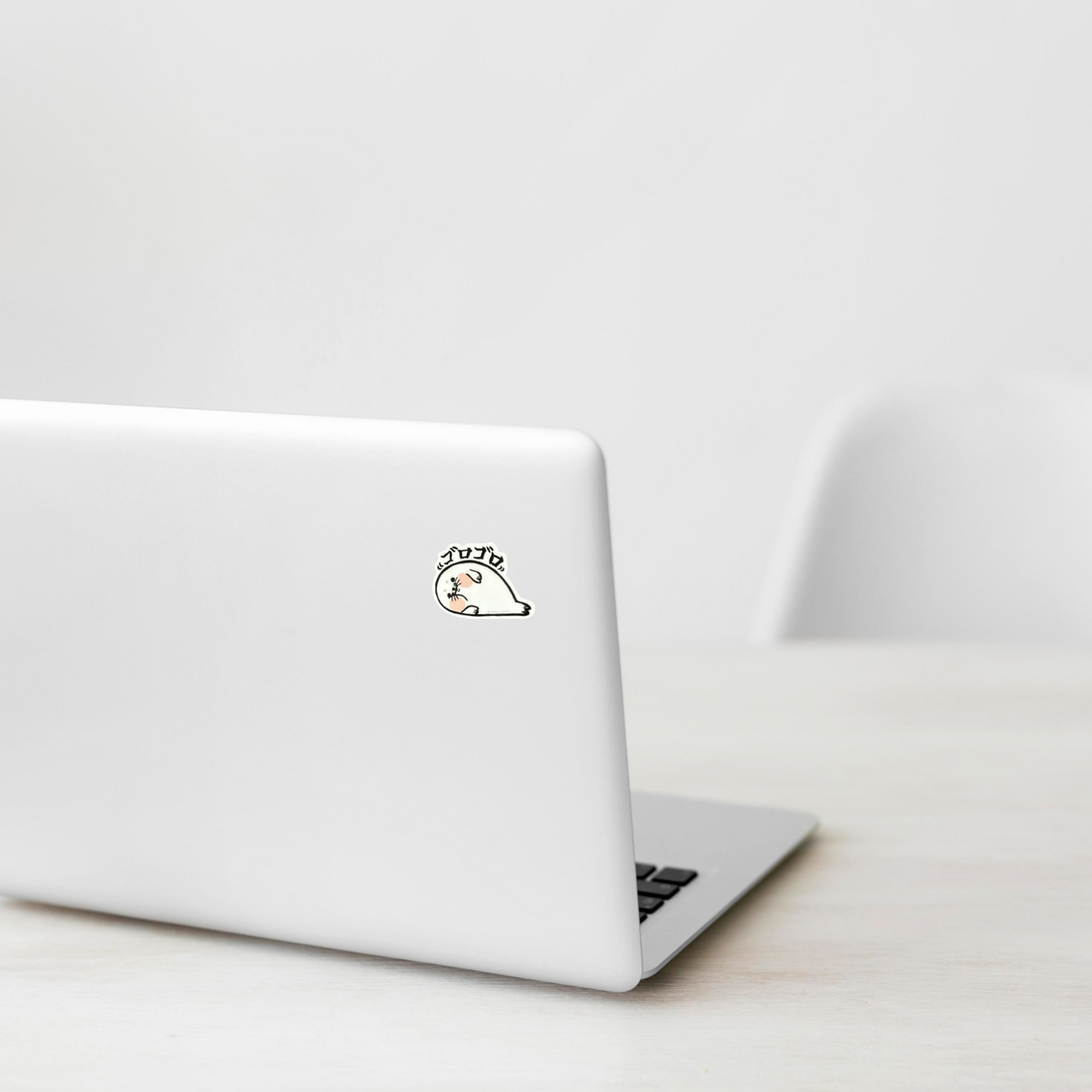 Baby Seal Side sticker on laptop — Shopify PhotoRoom template, verified original photograph