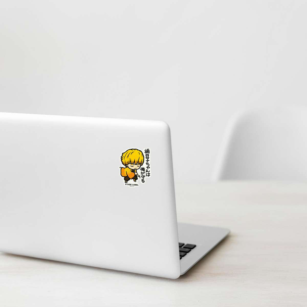 Demon Slayer - Zenitsu Agatsuma 1 ✦ B-Side Label Sticker on a white laptop — Shopify template, original photograph