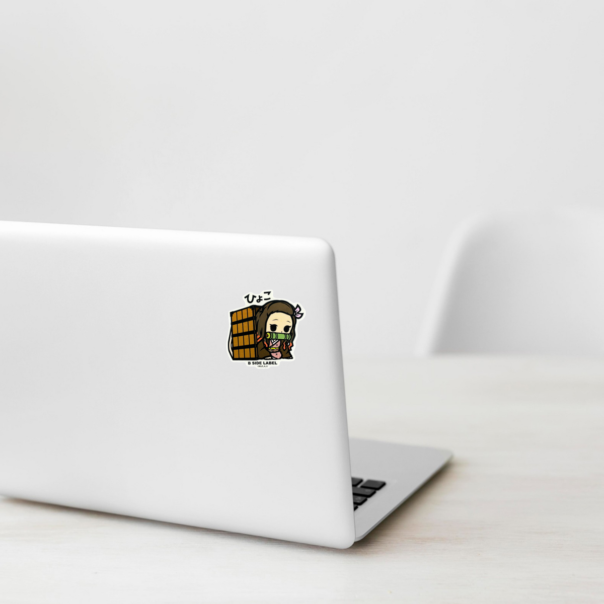 Demon Slayer - Kamado Nezuko 2 ✦ B-Side Label Sticker on a white laptop — Shopify template, original photograph