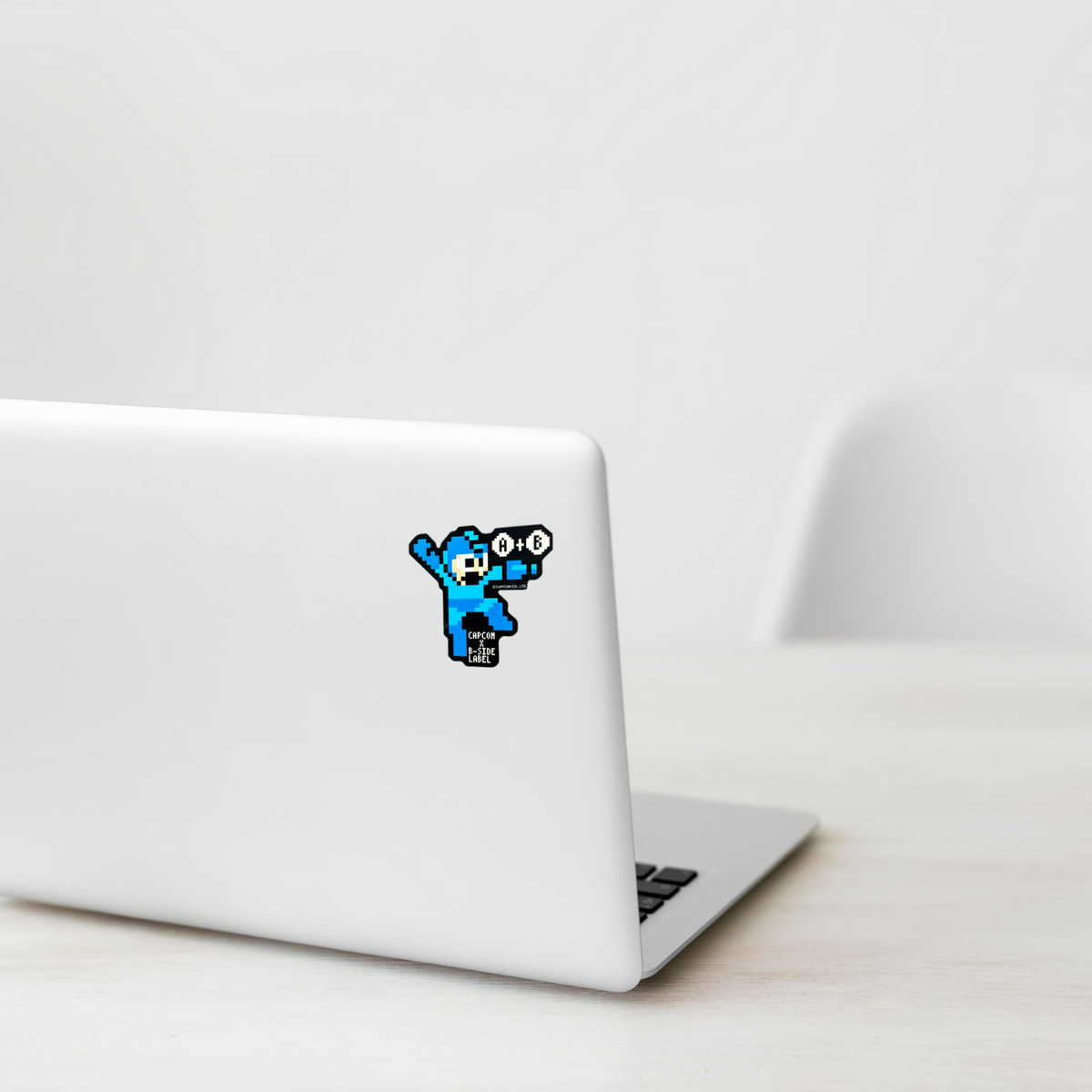 Mega Man Rockman 8-Bit ✦ B-Side Label Sticker on a white laptop — Shopify template, original photograph