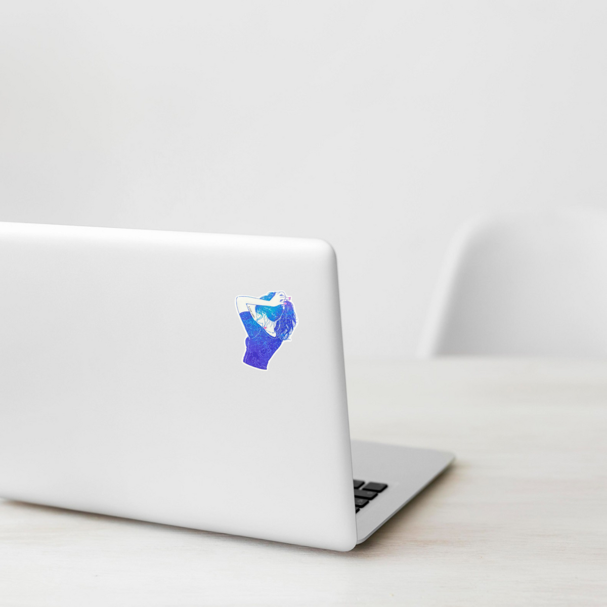 Blue T-Shirt & Ponytail ✦ B-Side Label Sticker on a white laptop — Shopify template, original photograph