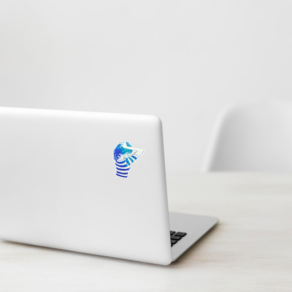 Striped T-Shirt & Ponytail ✦ B-Side Label Sticker on a white laptop — Shopify template, original photograph