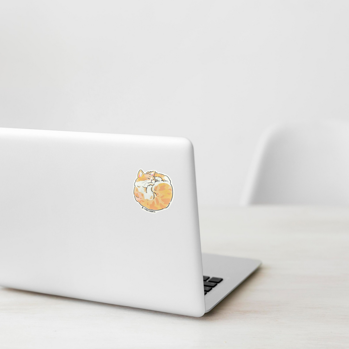 Cute Brown Balled Up Cat ✦ B-Side Label Sticker — laptop scene using the Shopify PhotoRoom template and visually verified original photograph