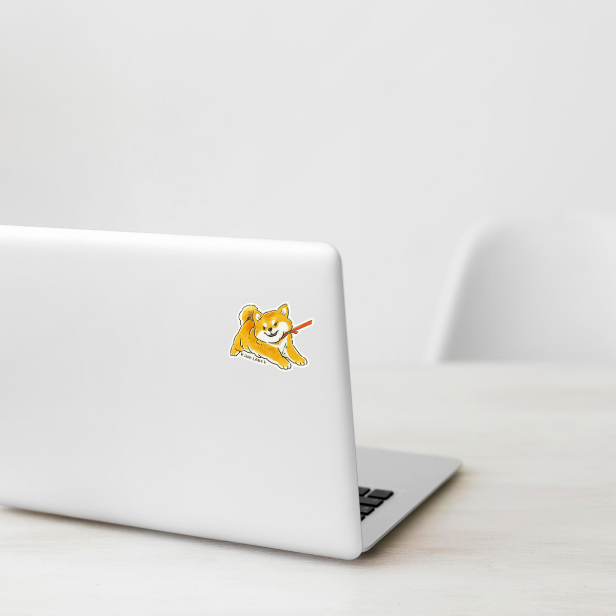 Cute Dog Refusing ✦ B-Side Label Sticker on a white laptop — Shopify template, original photograph
