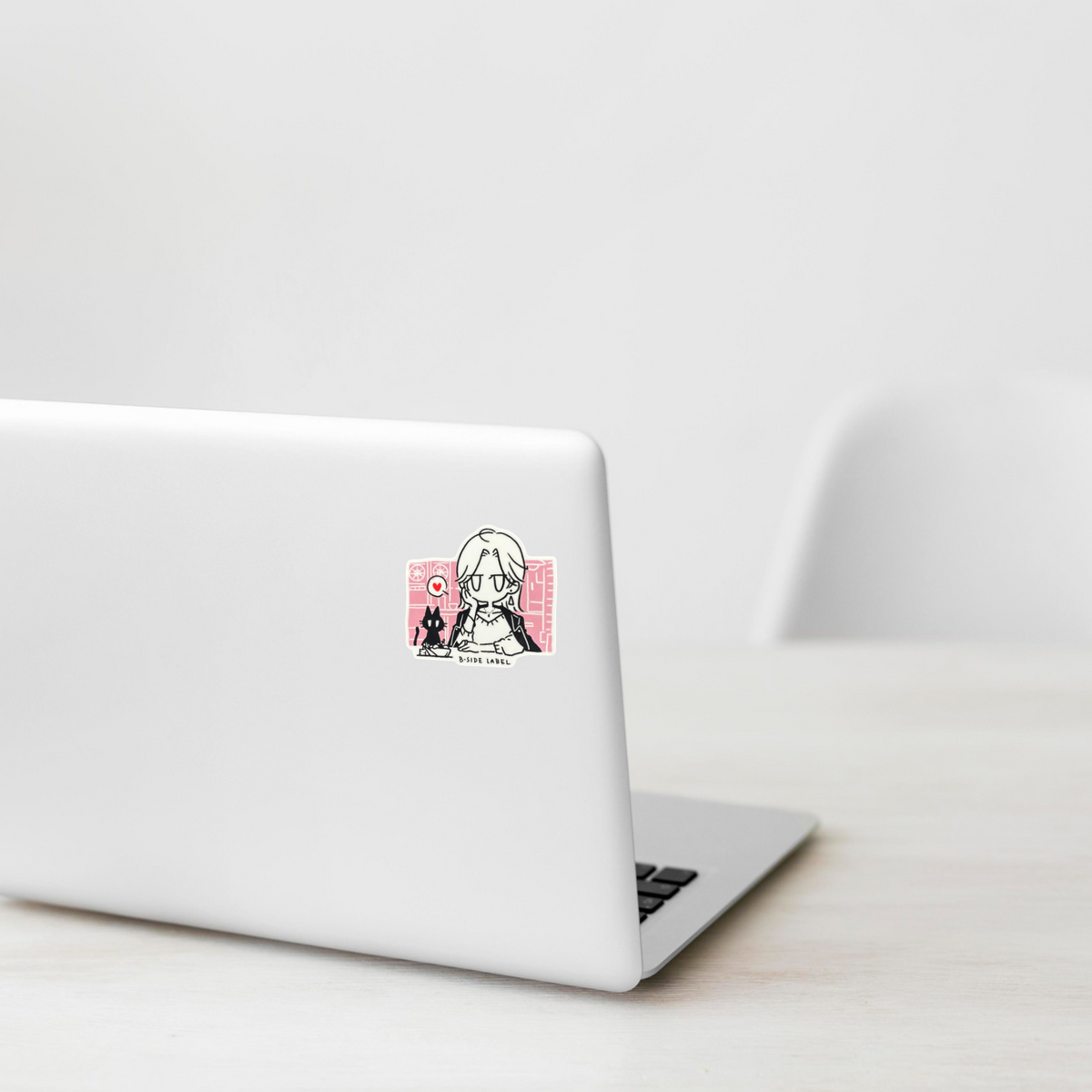 Lady and Kitten At Dinner ✦ B-Side Label Sticker on a white laptop — Shopify template, original photograph