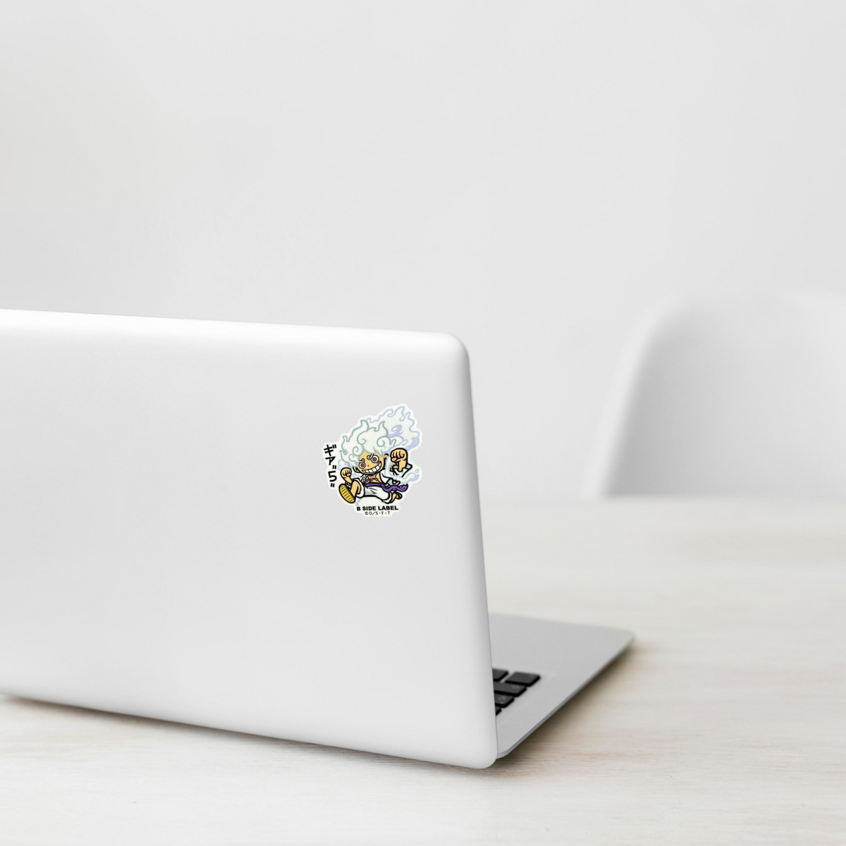 One Piece Luffy Gear 5 ✦ B-Side Label Sticker on a white laptop — Shopify template, original photograph