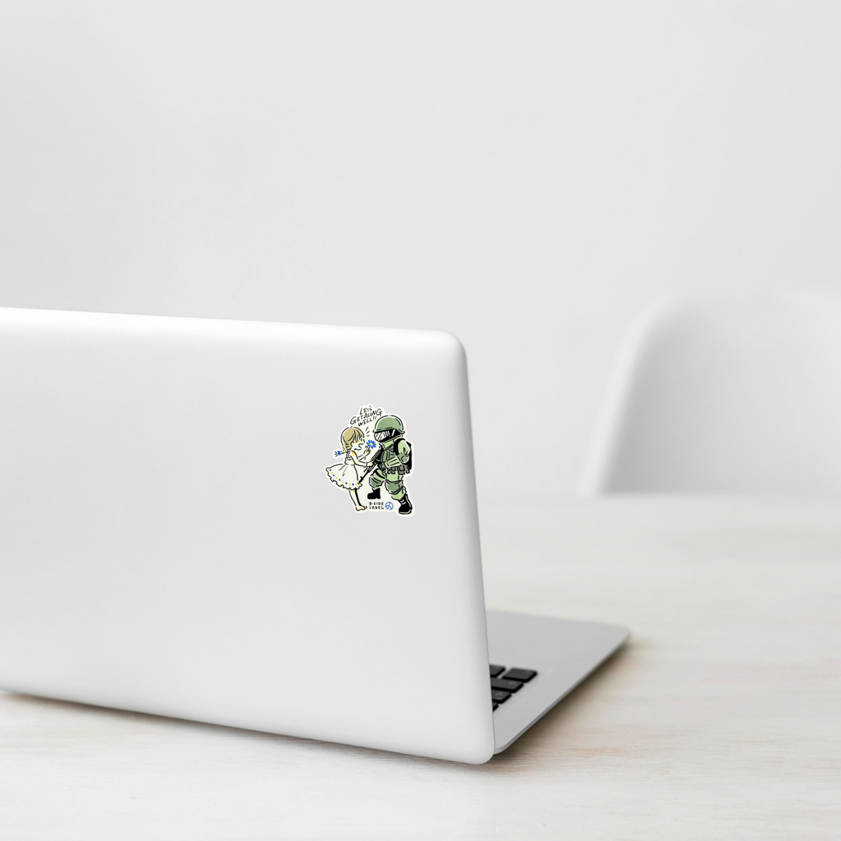 Hippie Flower-Child & Soldier ✦ B-Side Label Sticker on a white laptop — Shopify template, original photograph