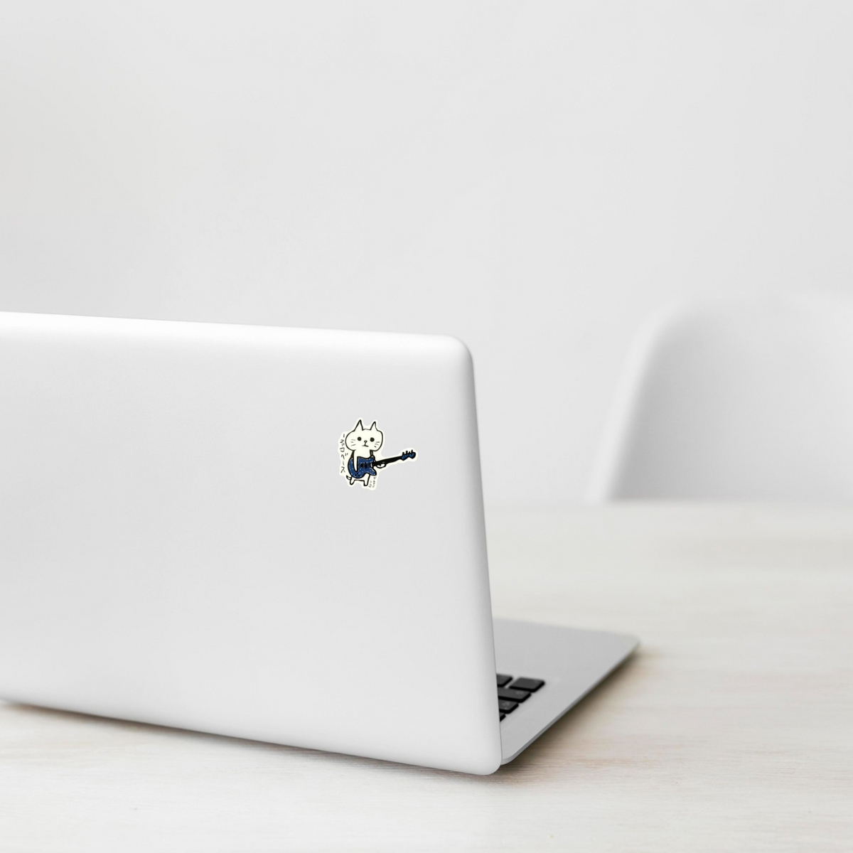 Cat Electric Bass Player ✦ B-Side Label Sticker on a white laptop — Shopify Small template, original photograph
