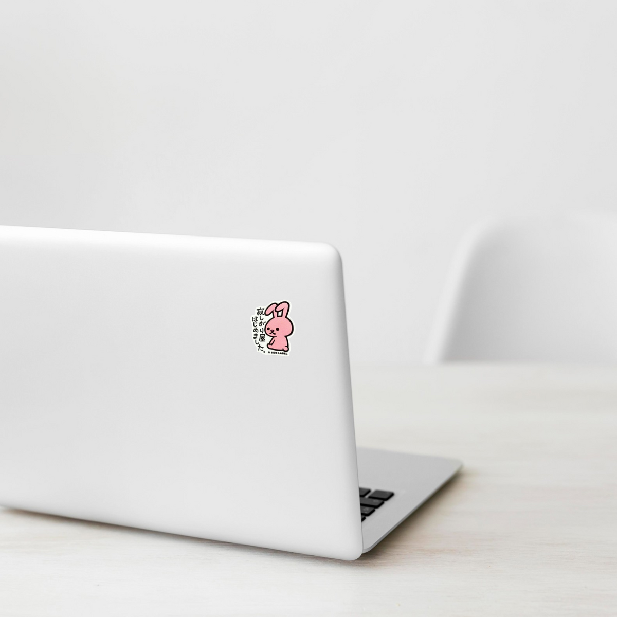 Cute Pink Baby Rabbit ✦ B-Side Label Sticker on a white laptop — Shopify Small template, original photograph