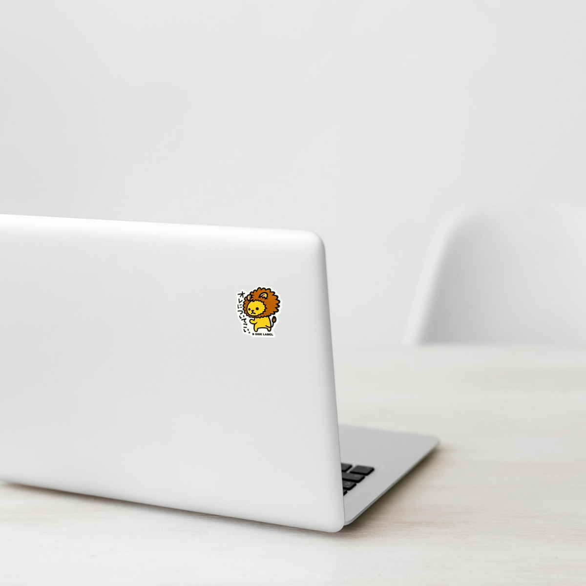Cute Baby Lion ✦ B-Side Label Sticker on a white laptop — Shopify Small template, original photograph